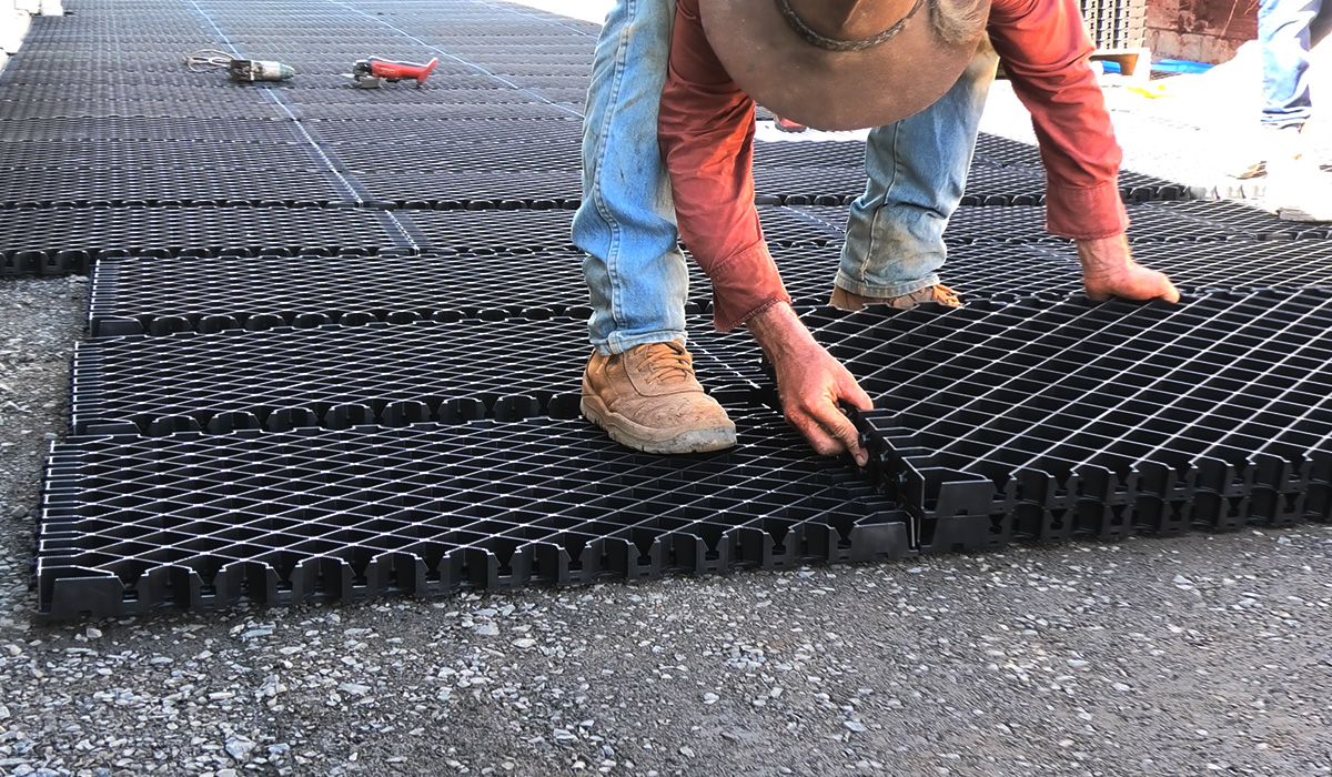 Ground stabilisation system installed on a construction site with heavy equipment operating on a stabilised surface